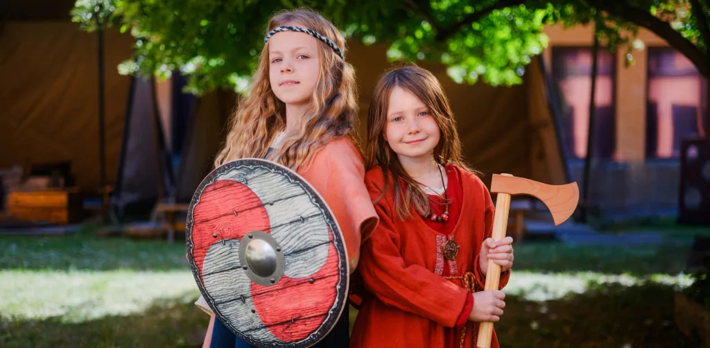 Children holding shield and axe