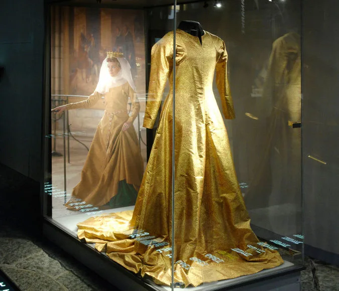 Gold silk dress in a glass case