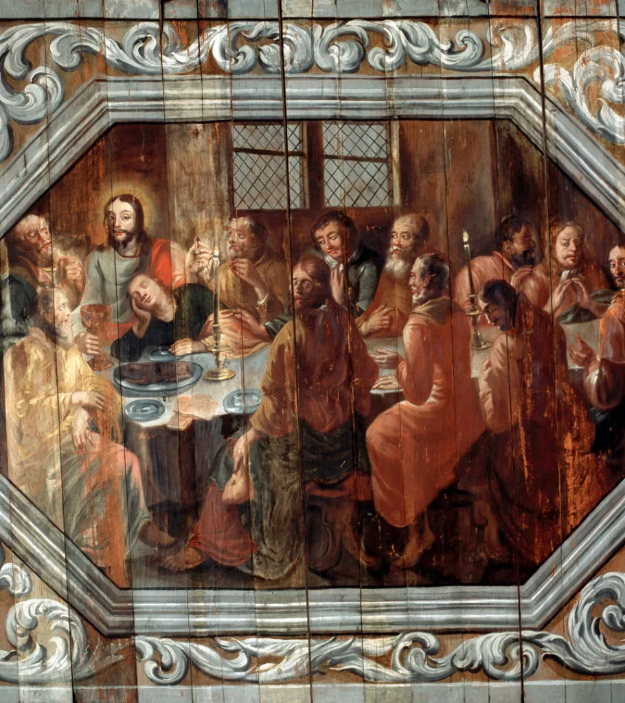 Sculpture of angel blowing a trumpet in the Baroque Hall. In the background, the oak ceiling.