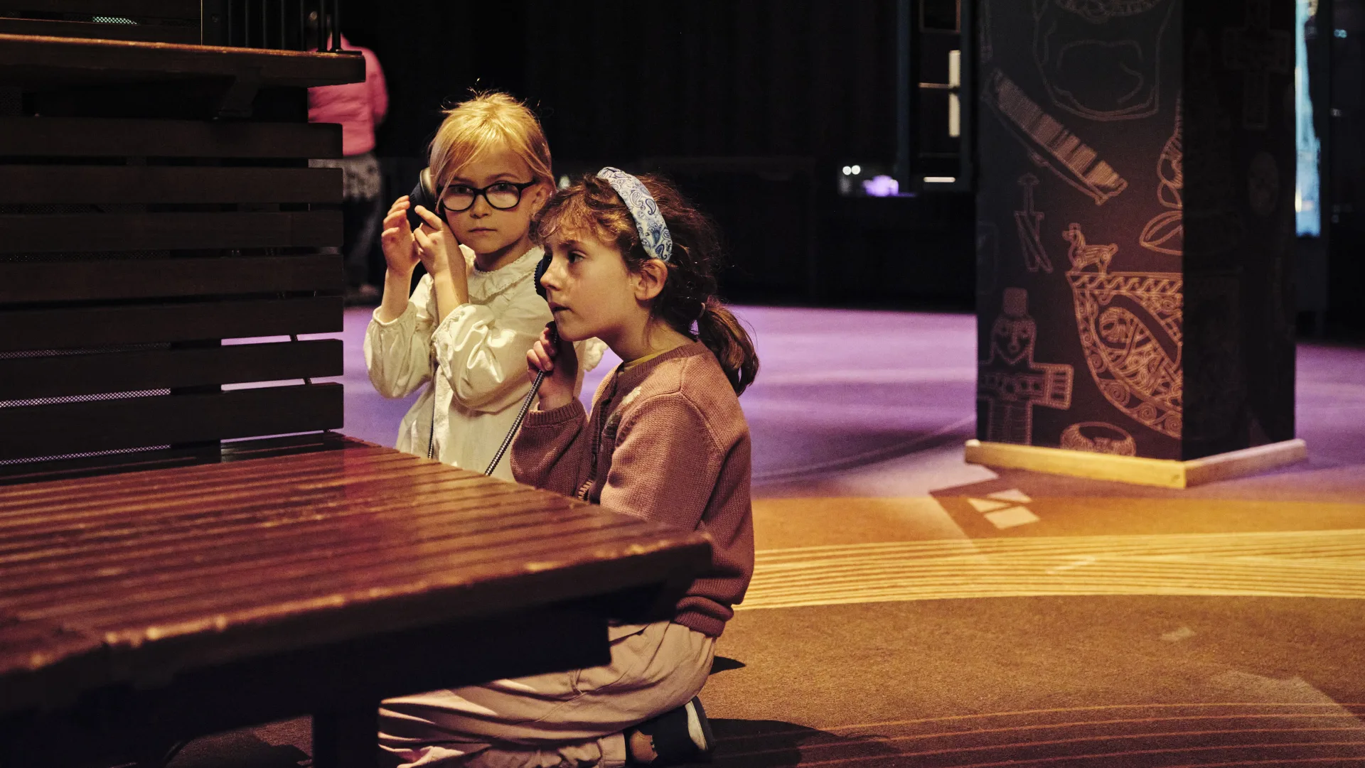 Two children in the exhibition The Viking World.