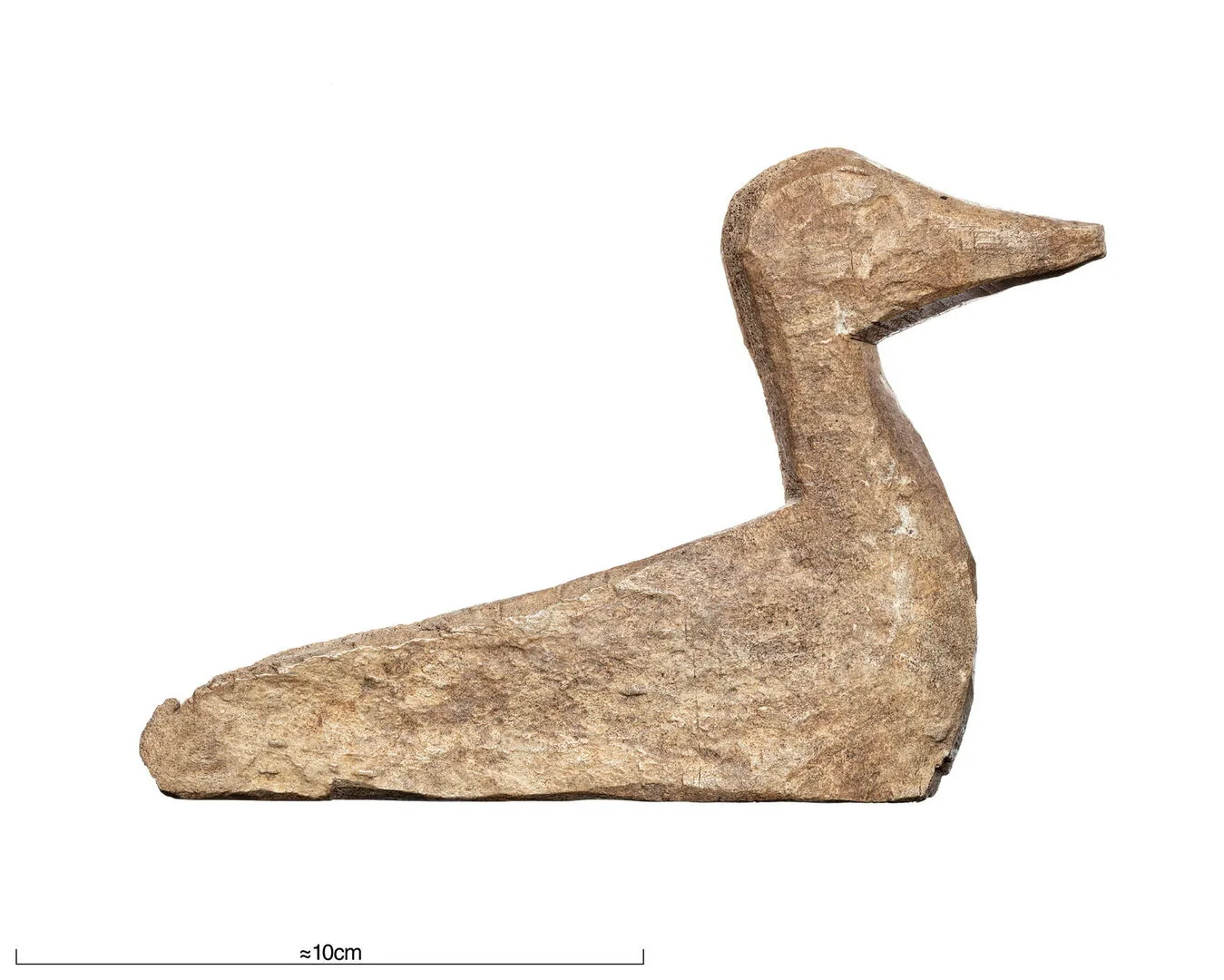 A small, crudely made figurine with a wedge-shaped body, short neck and pointy beak.