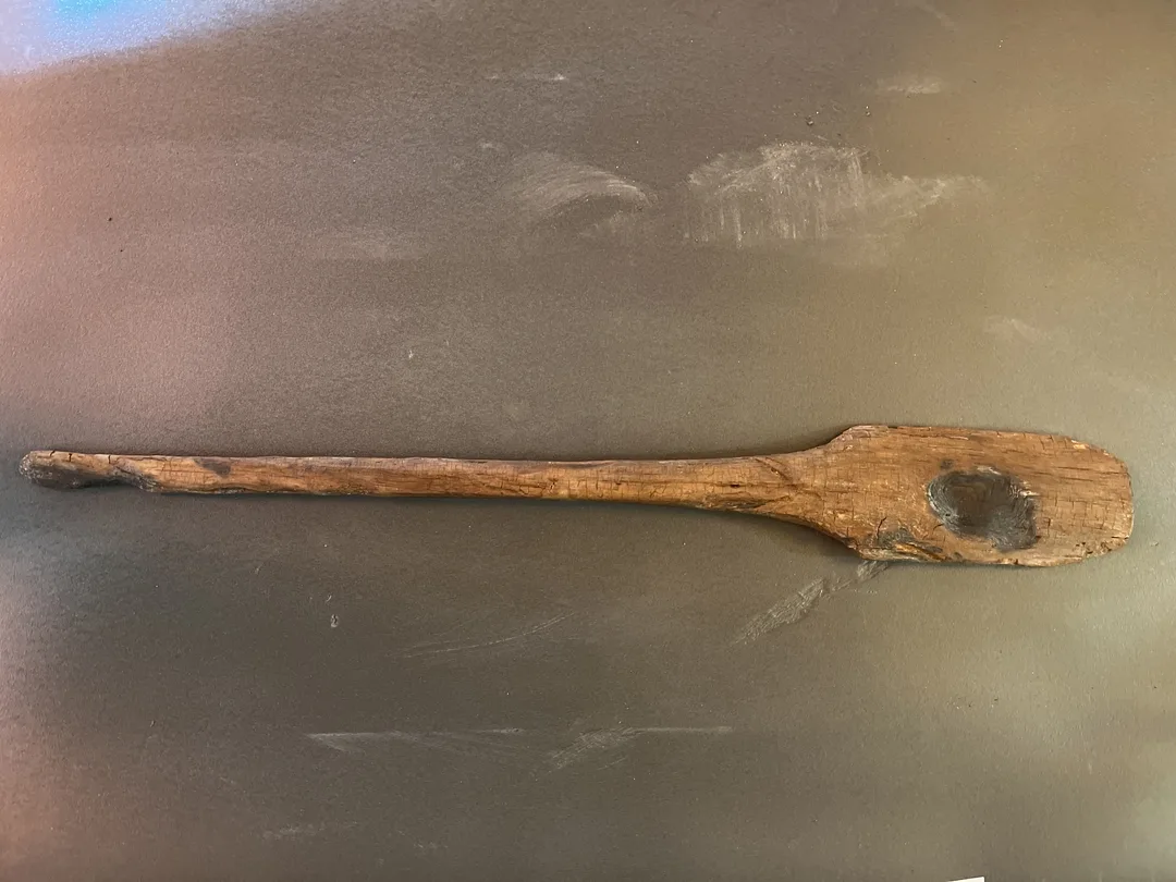 A wooden paddle