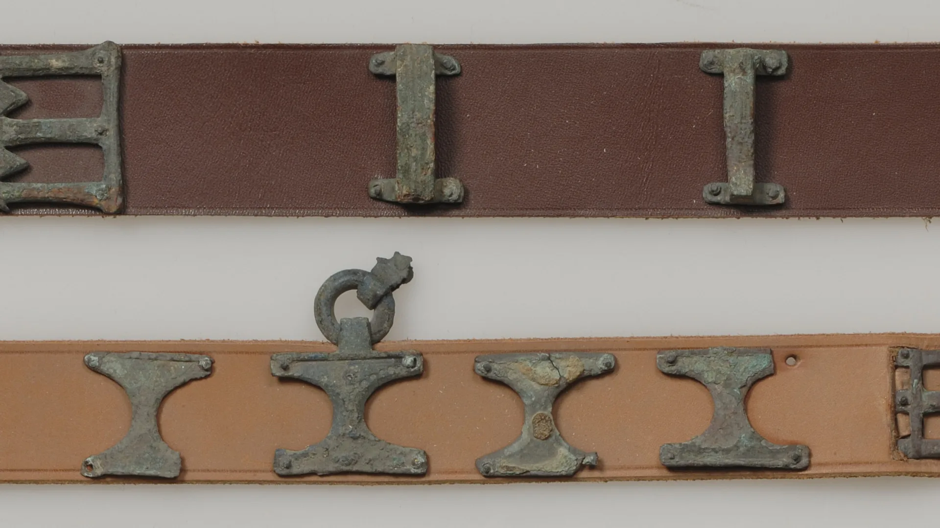 Leather belts with buckles.