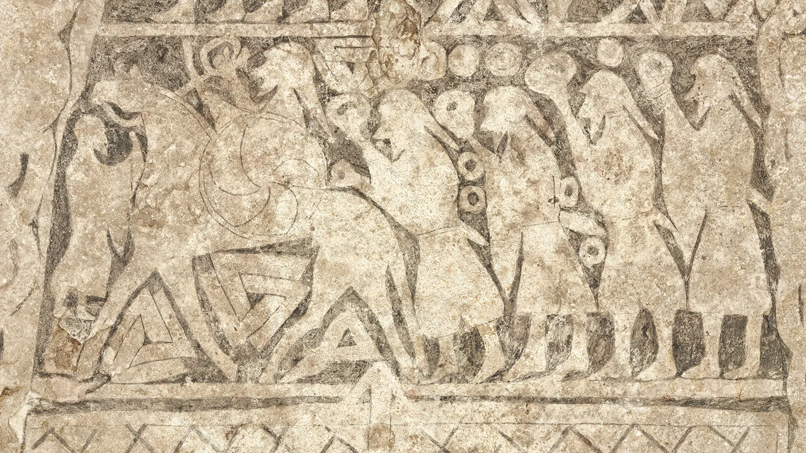 Details on a picture stone showing people in procession 