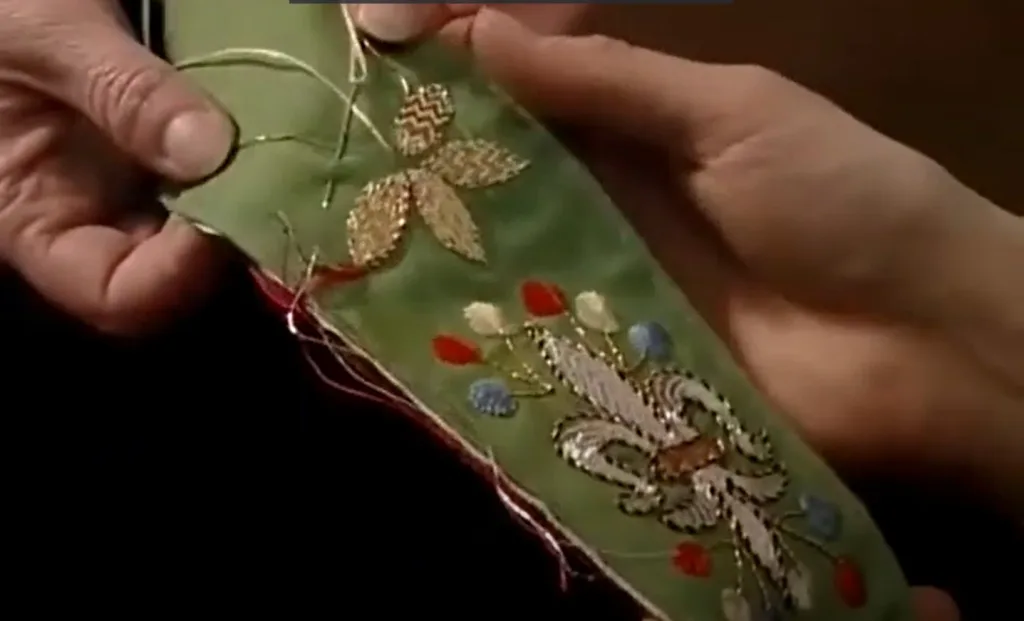 A person embroidering in detail