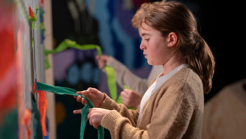 Children exploring one of the hands-on activities in the museum exhibition.