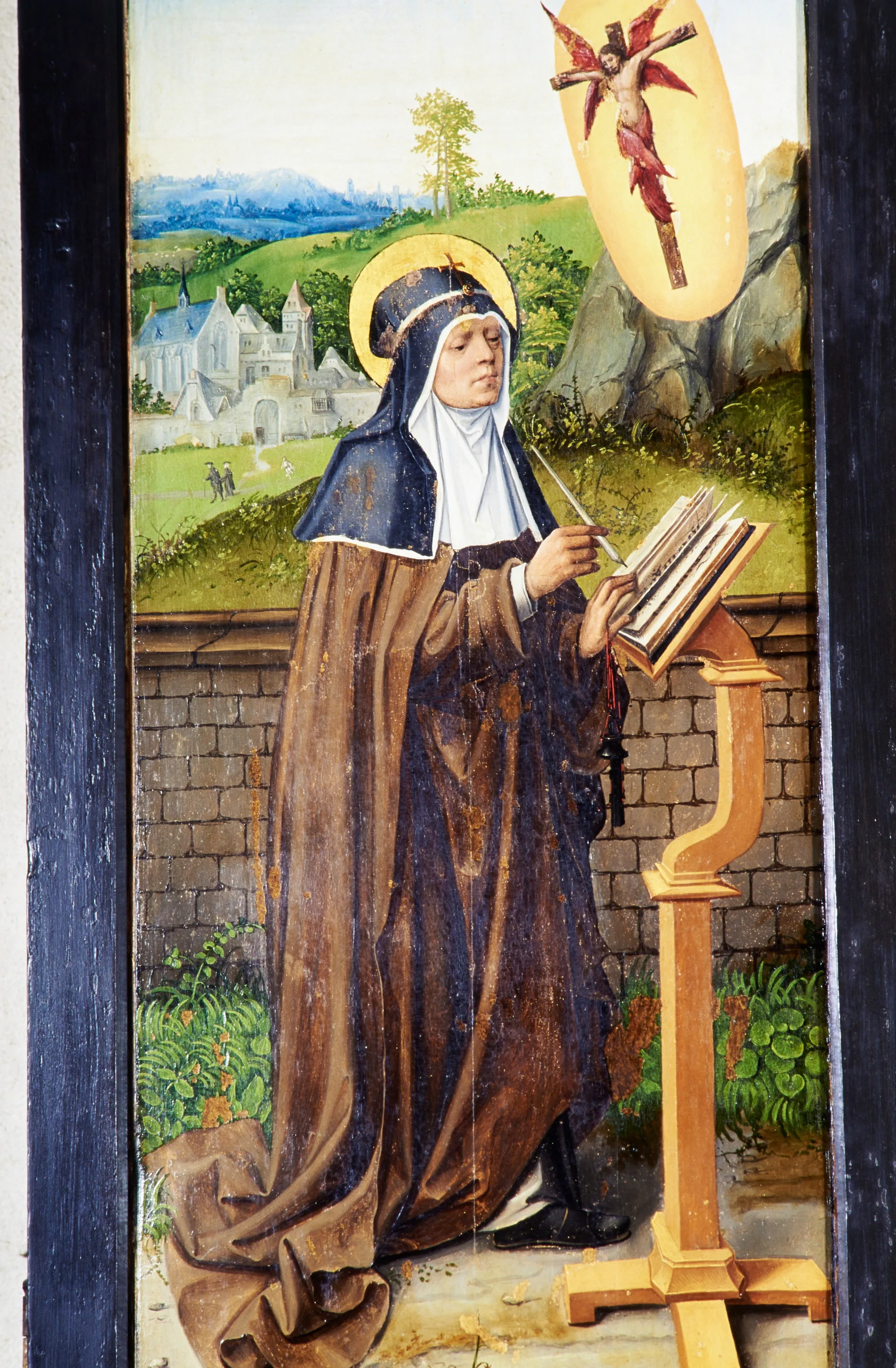 Saint Bridget kneeling with a book