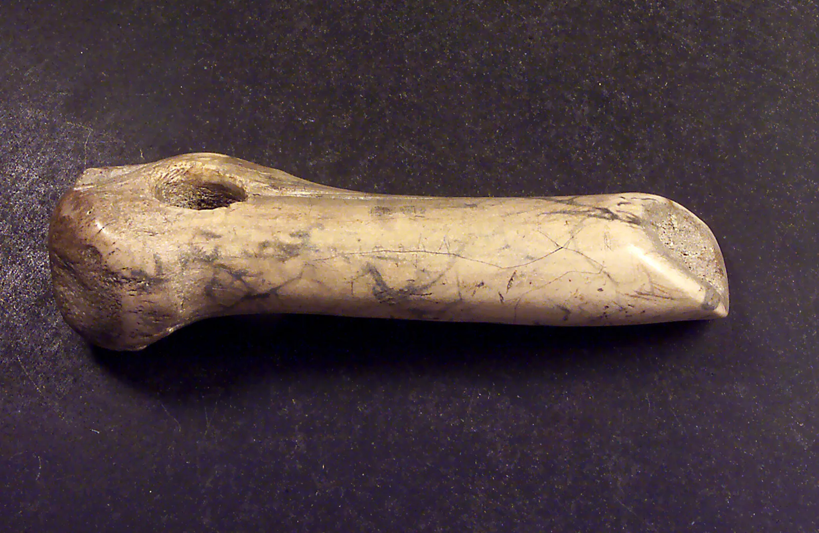 An engraved axe made of antler
