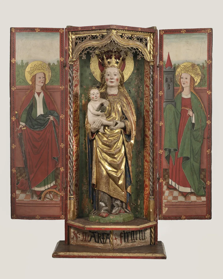 Wooden altarpiece of Madonna and child with two women on either side