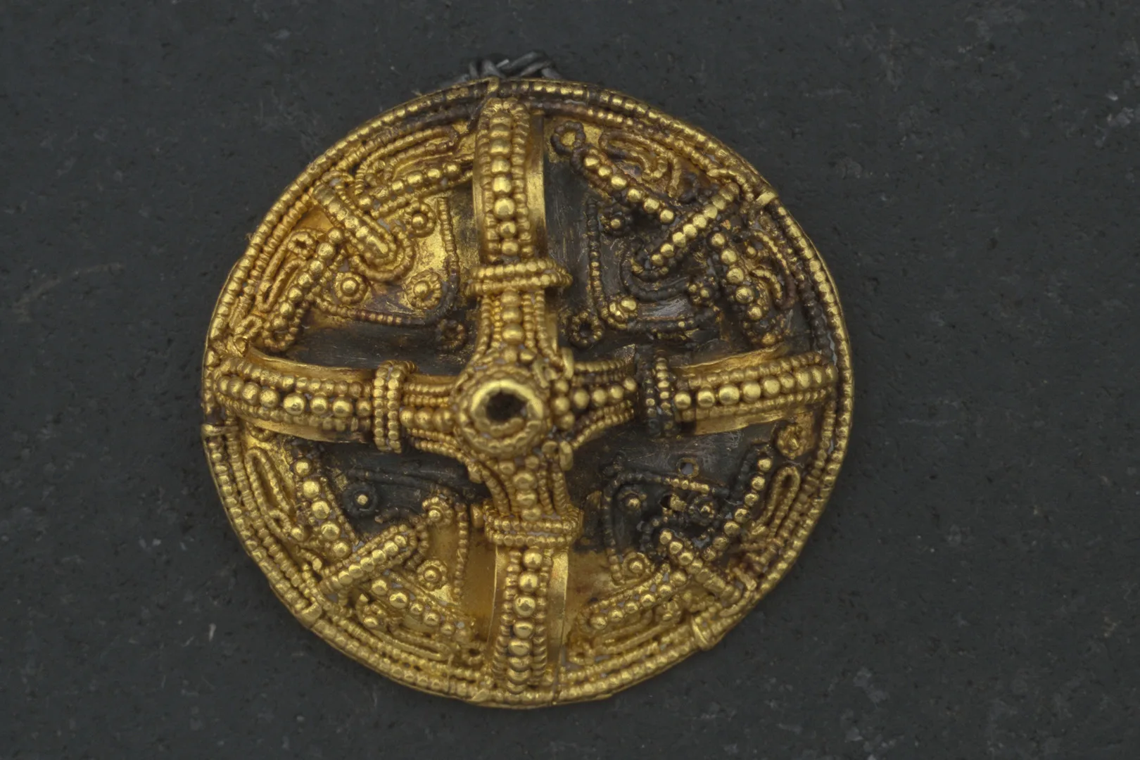 Circular gold brooch