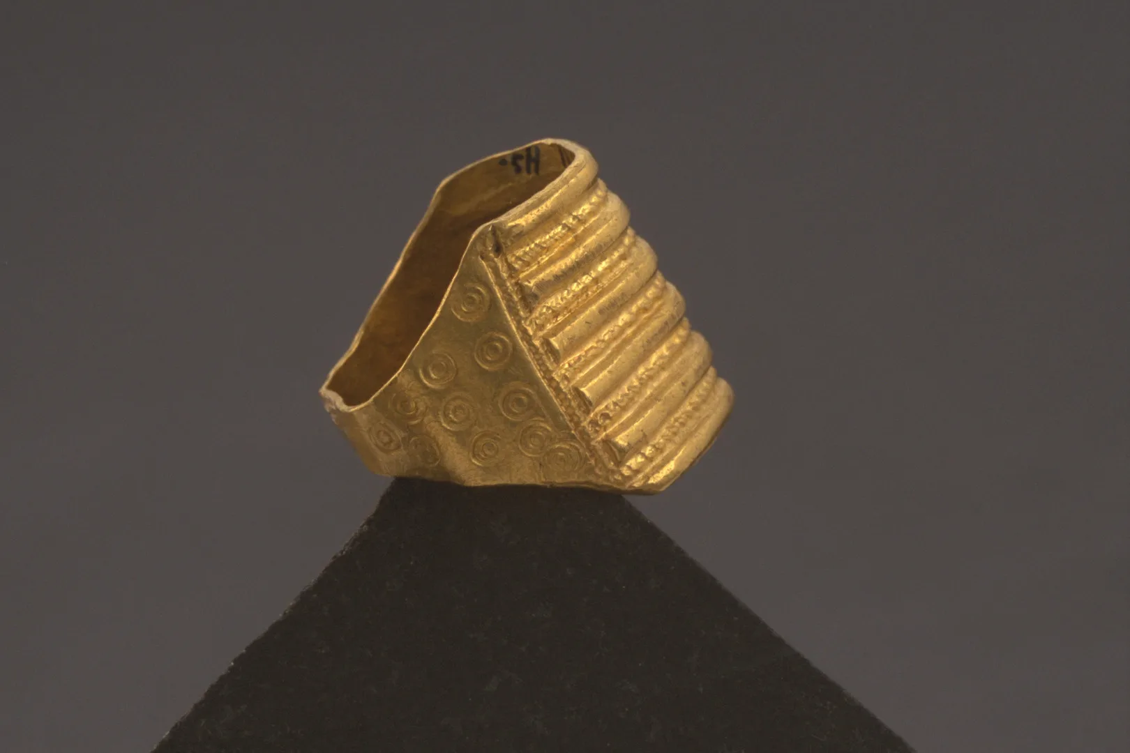 A large gold ring, thinner on the inner side.
