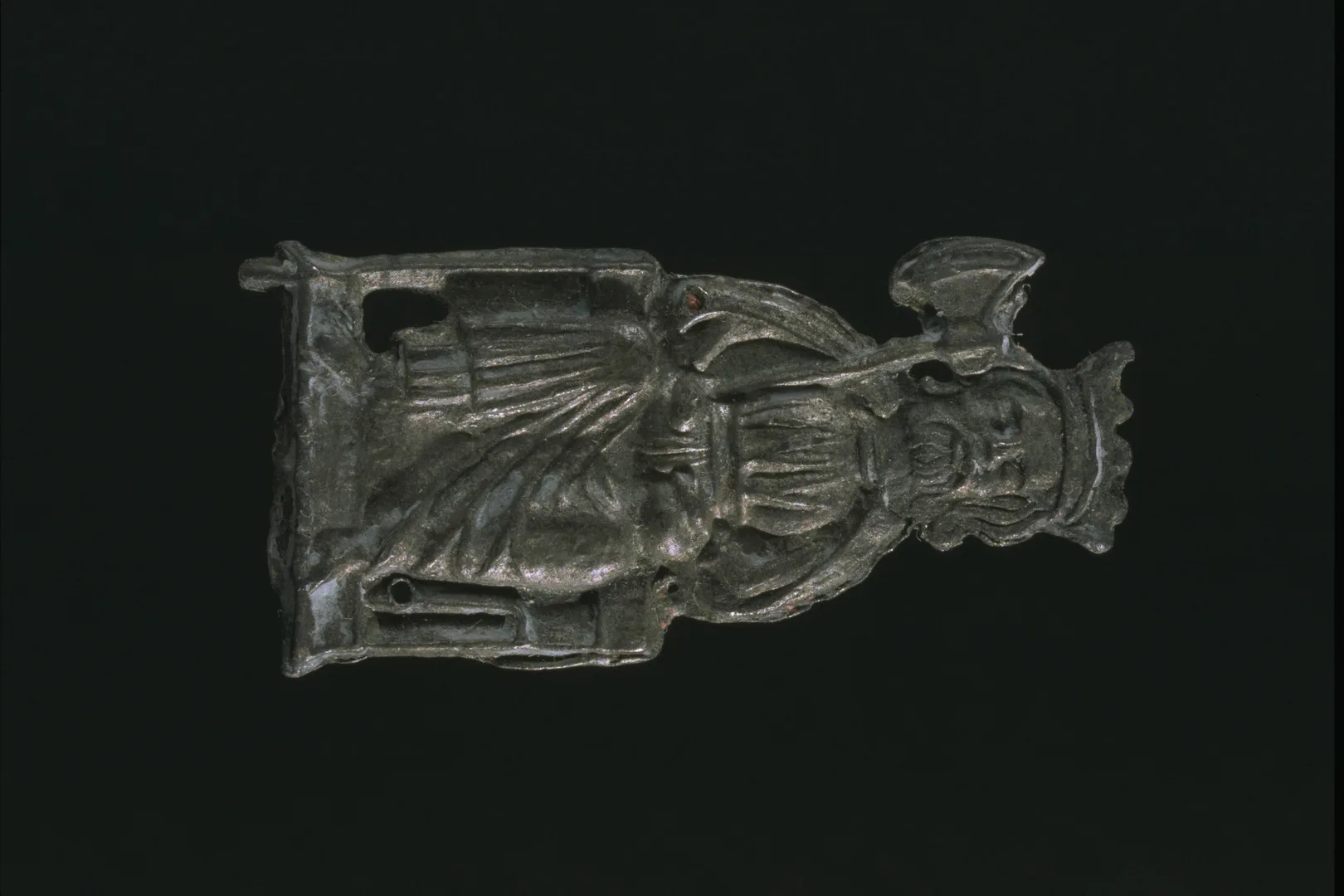 Metal figure of sitting man with crown and axe