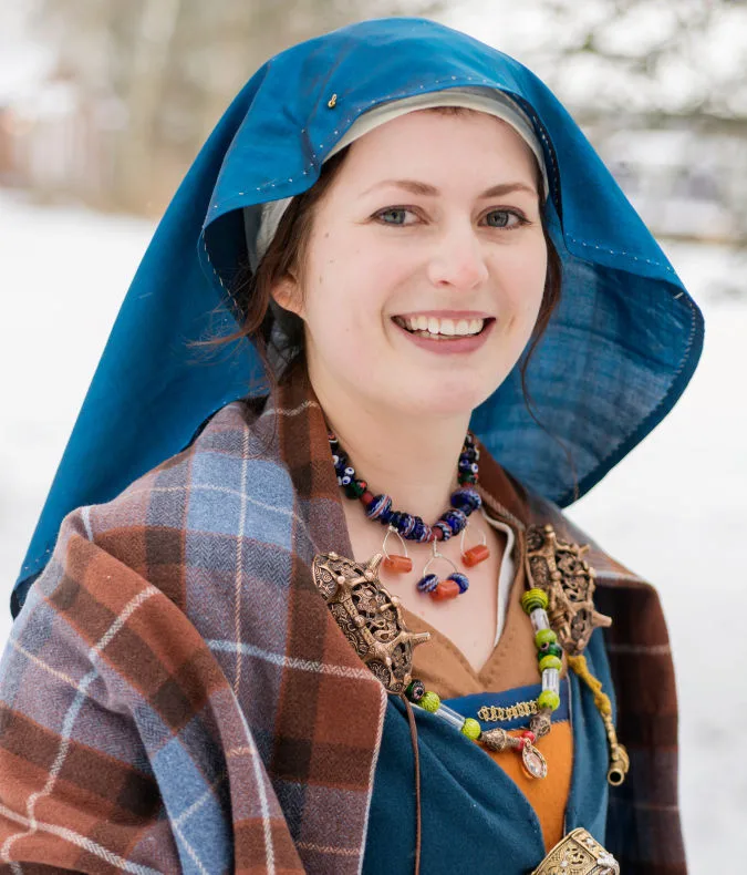 Person in reconstructed Viking Age clothes and headscarf