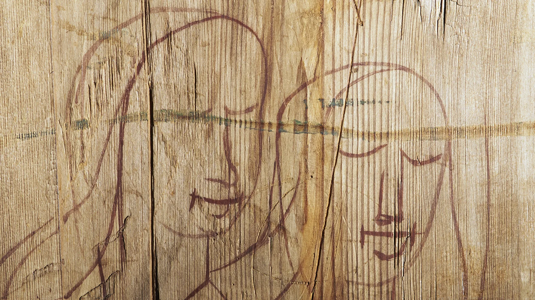 Two women carved into wood