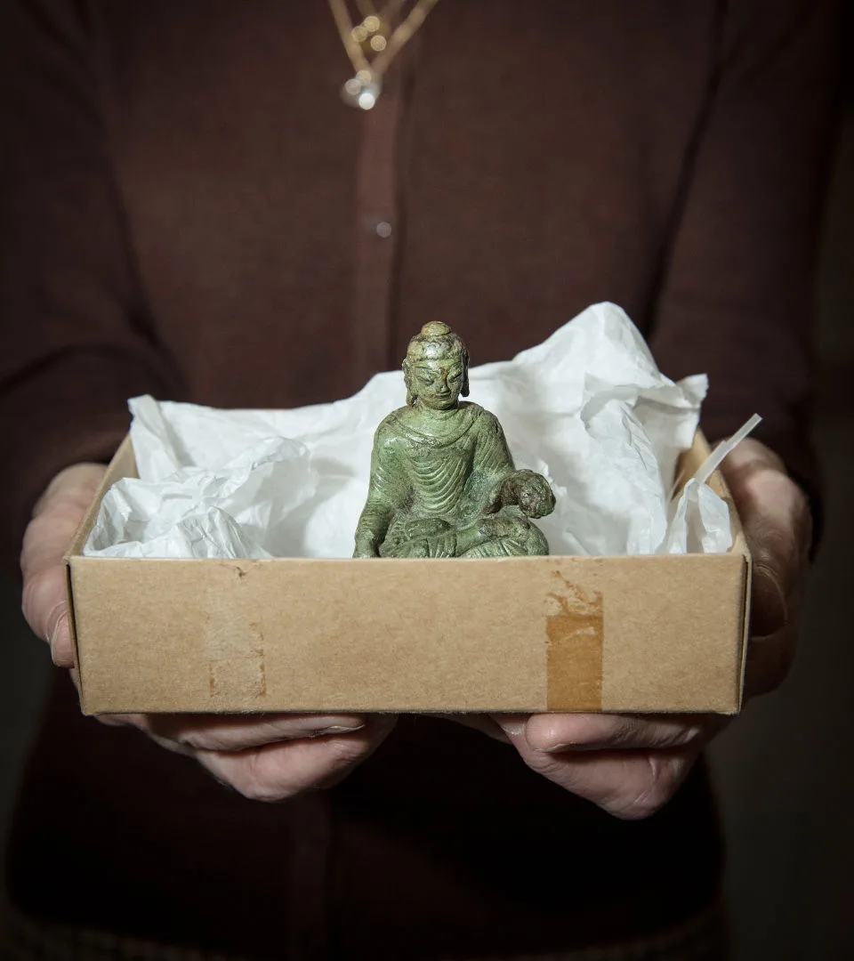 A buddah statue in a box.