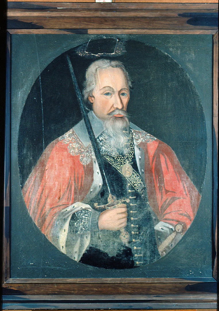 Portrait of a man with grey beard and hair. He is dressed in black clothes and a red cape. He is holding a sword in his right hand.