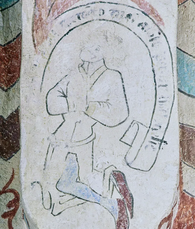 En man som ber knästående. 