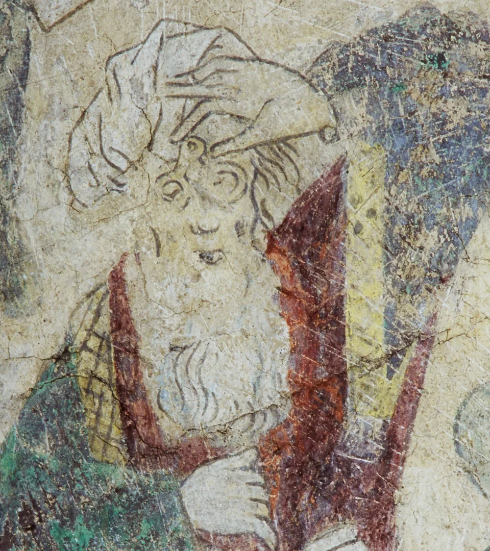 Painting of a bearded man holding a pair of spectacles in front of his eyes.
