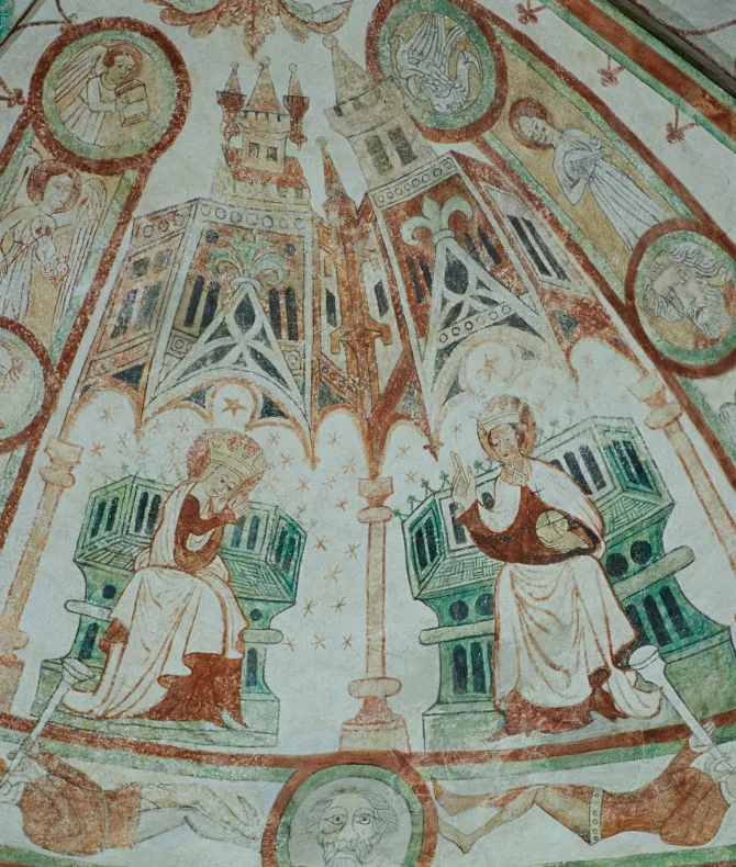 Två personer sitter på tron