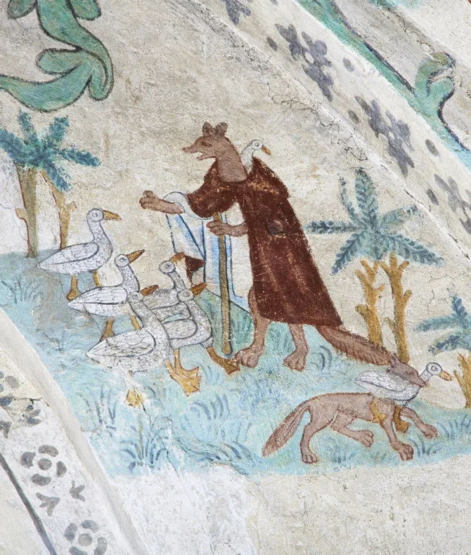 Geese with a dog-like animal wearing a red cape