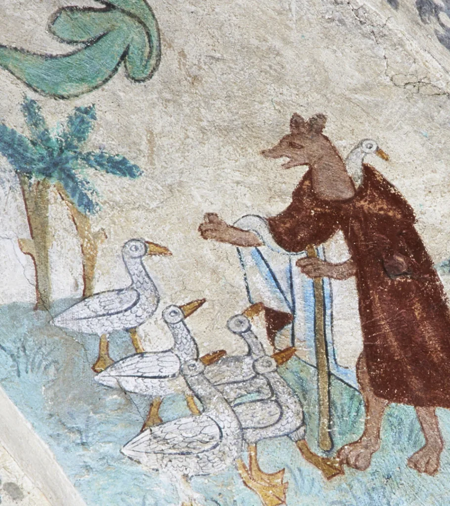 Gäss och ett stående djur