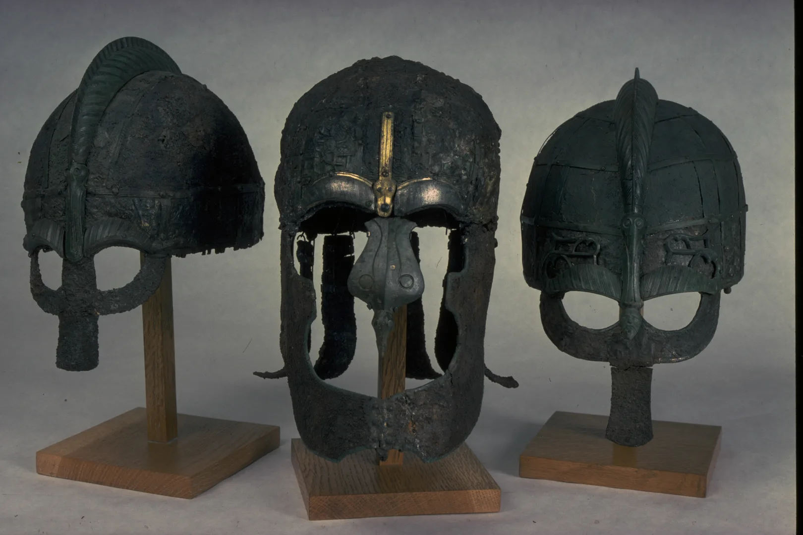 Three iron helmets