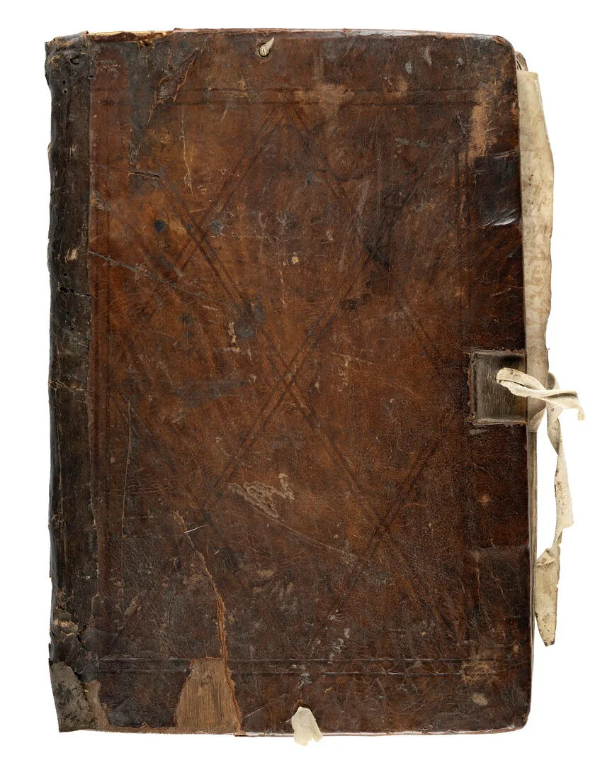 Front view of an old book with dark brown leather binding.