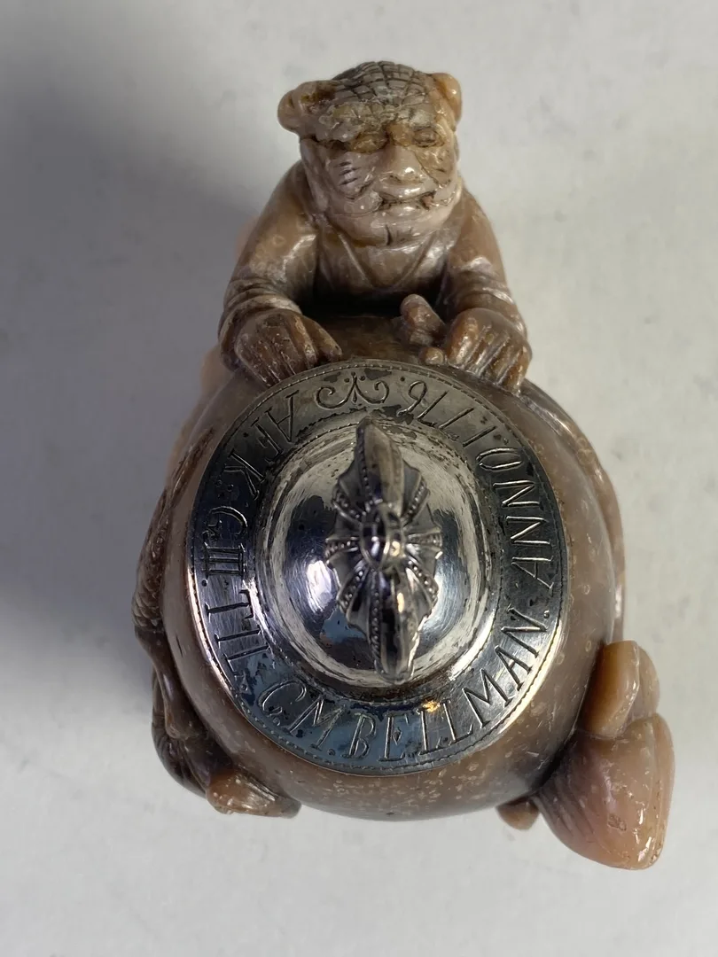 Inkwell seen from above, with a silver-engraved lid