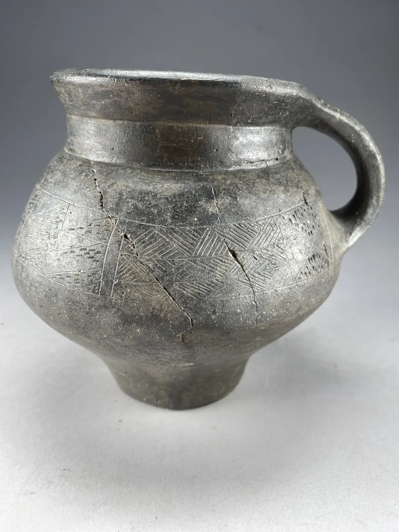 A ceramic vessel with cracks