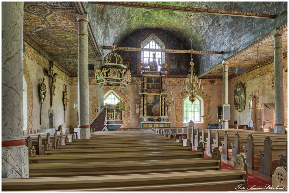 Interior of a church, with decorated ceilings and walls