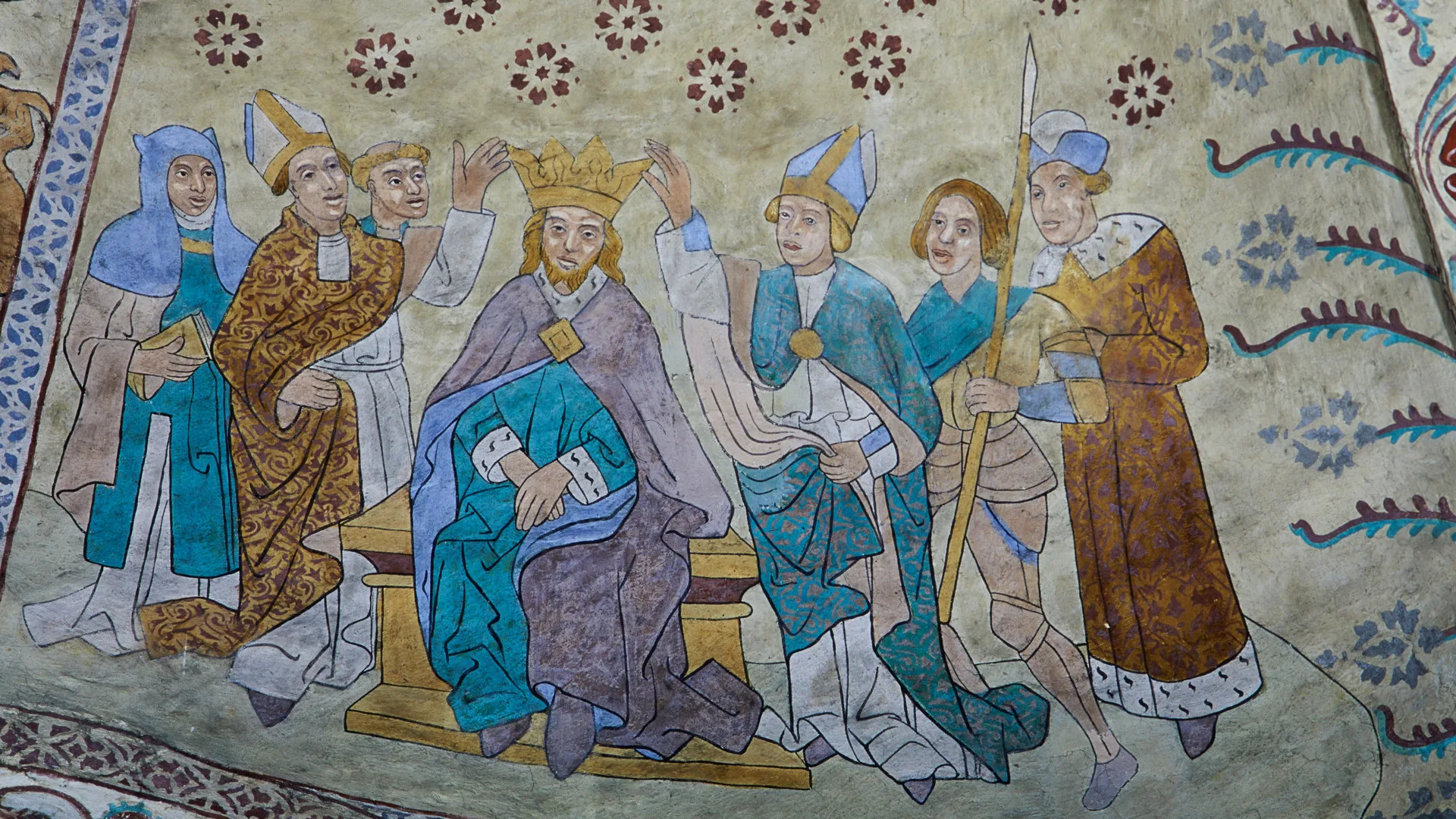 A painting depicting a person who is crowned king, surrounded by other people