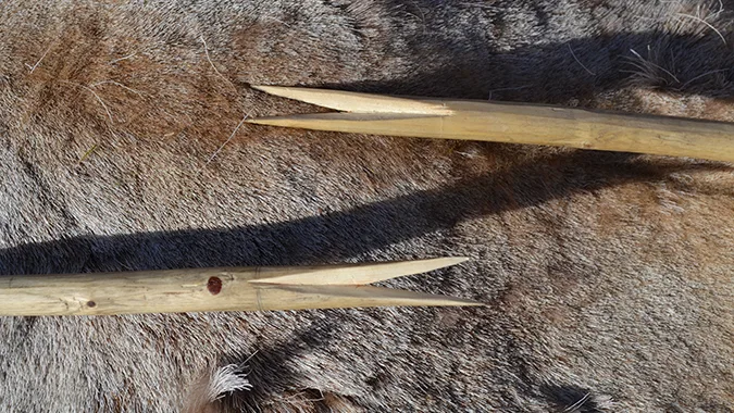 Two sharp tools laying on reindeer fur