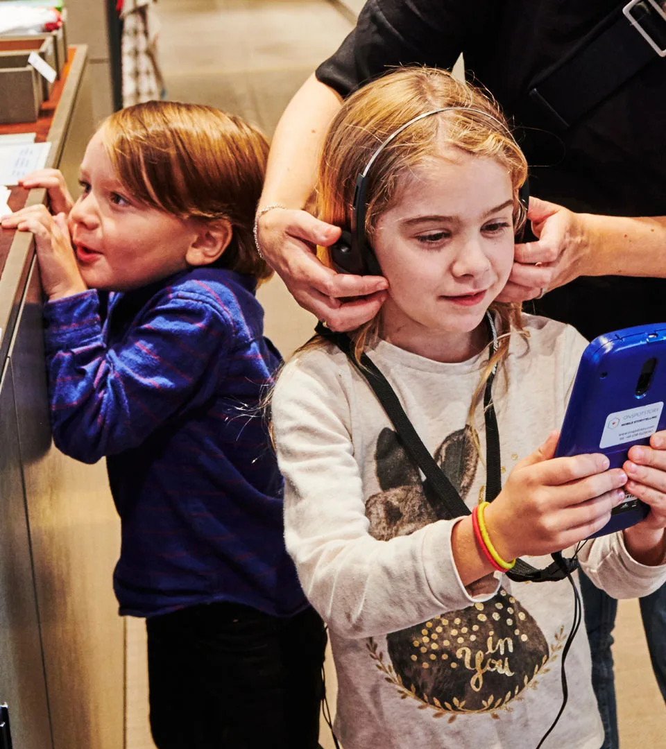 Children with an audio guide.