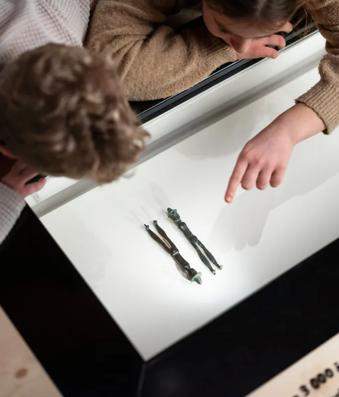 Children exploring one of the objects.