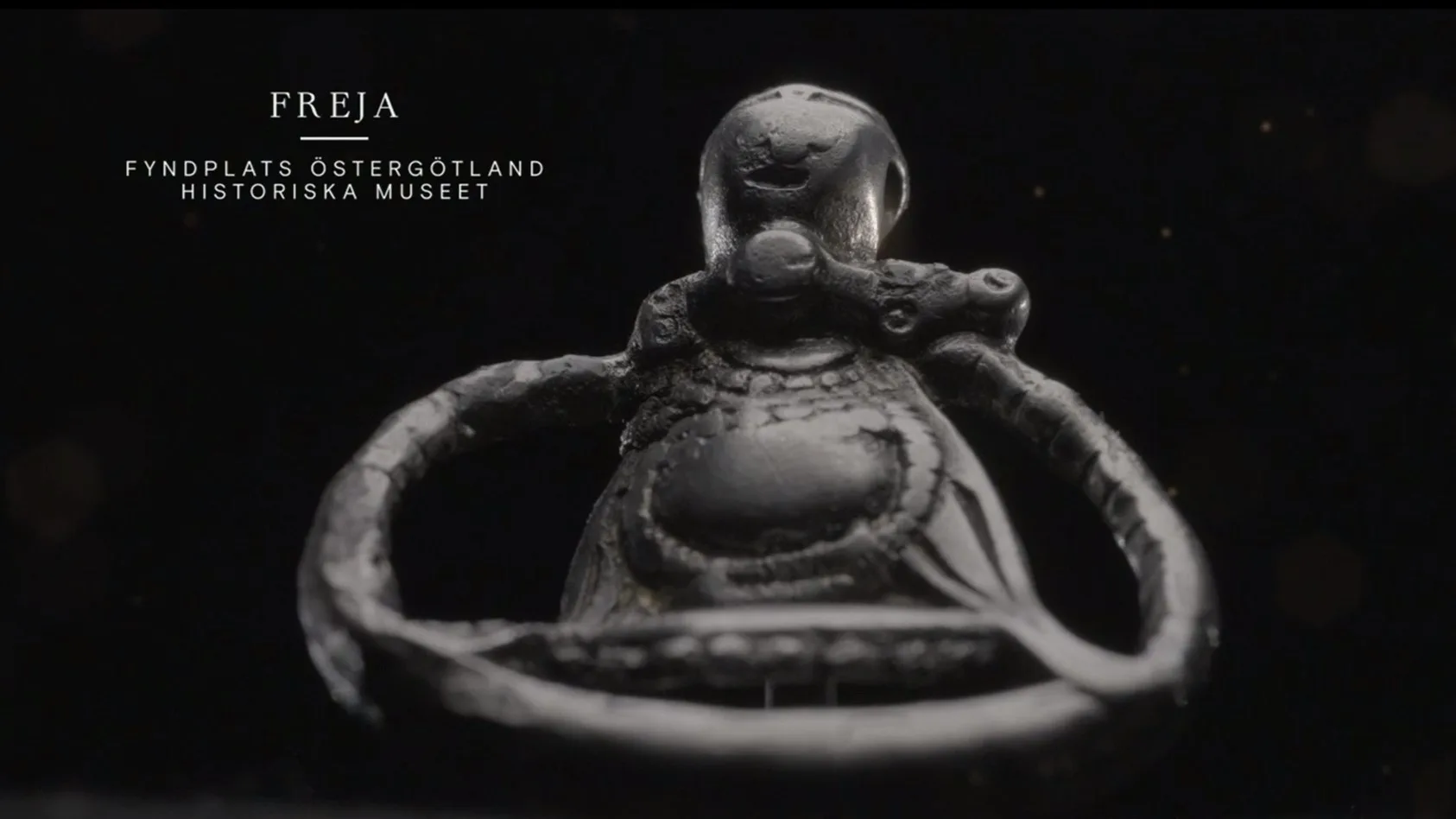 Ett smycke i form av en figur.