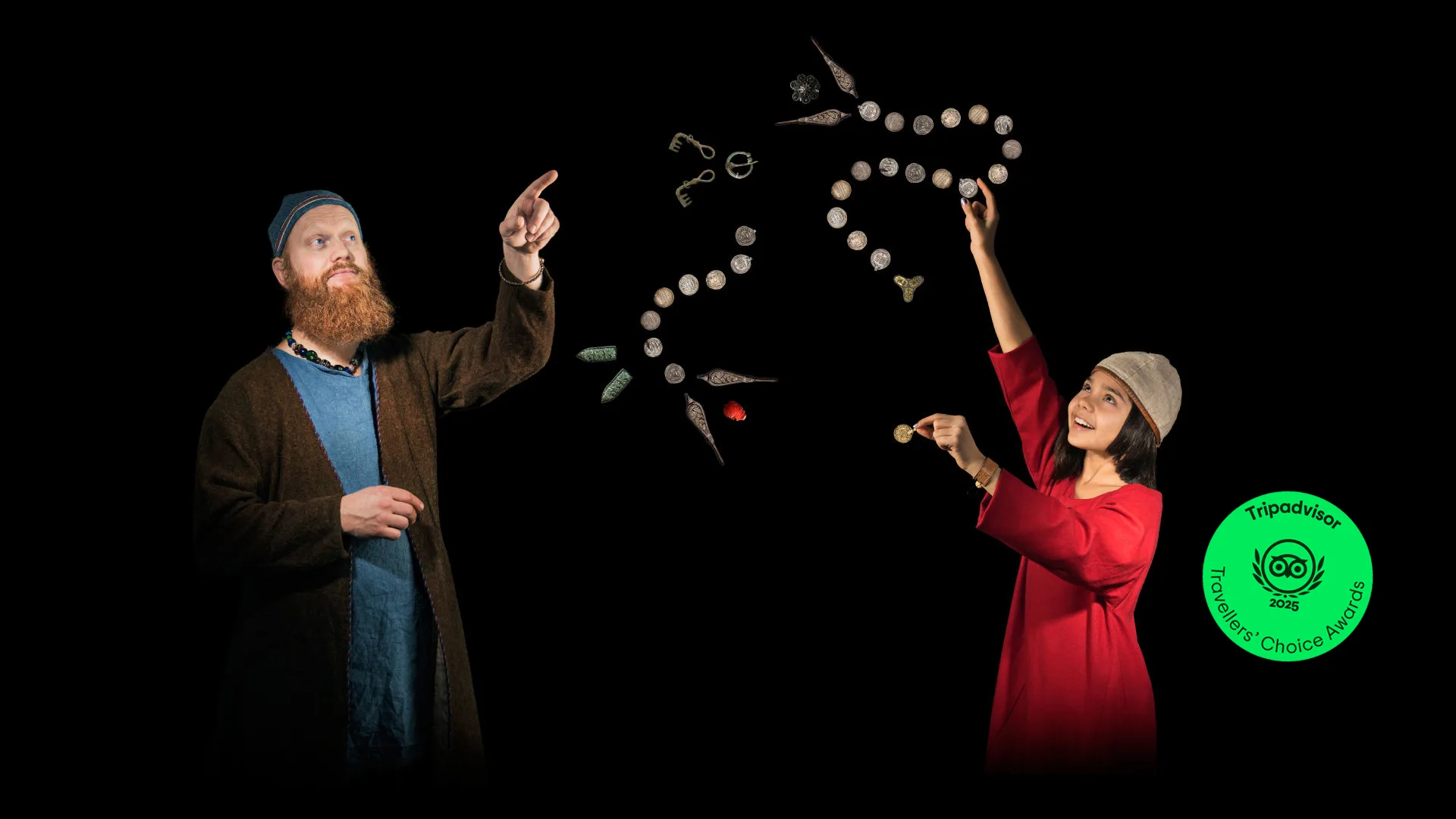 Two people dressed in traditional Viking Age clothing.