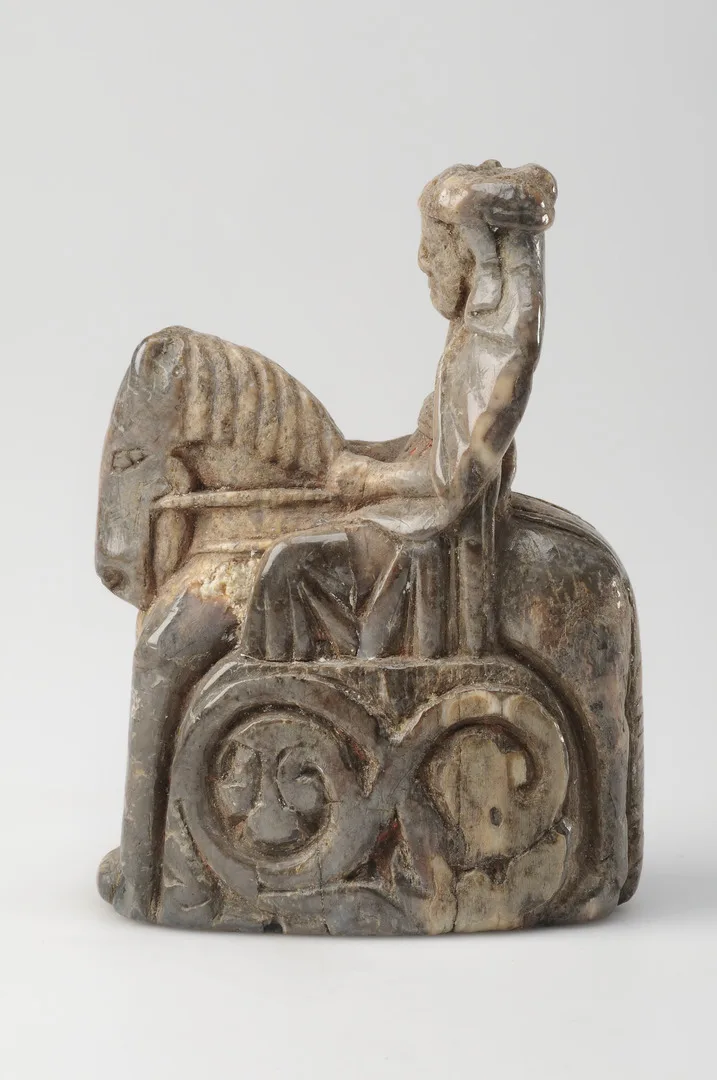 Small chess piece depicting the queen