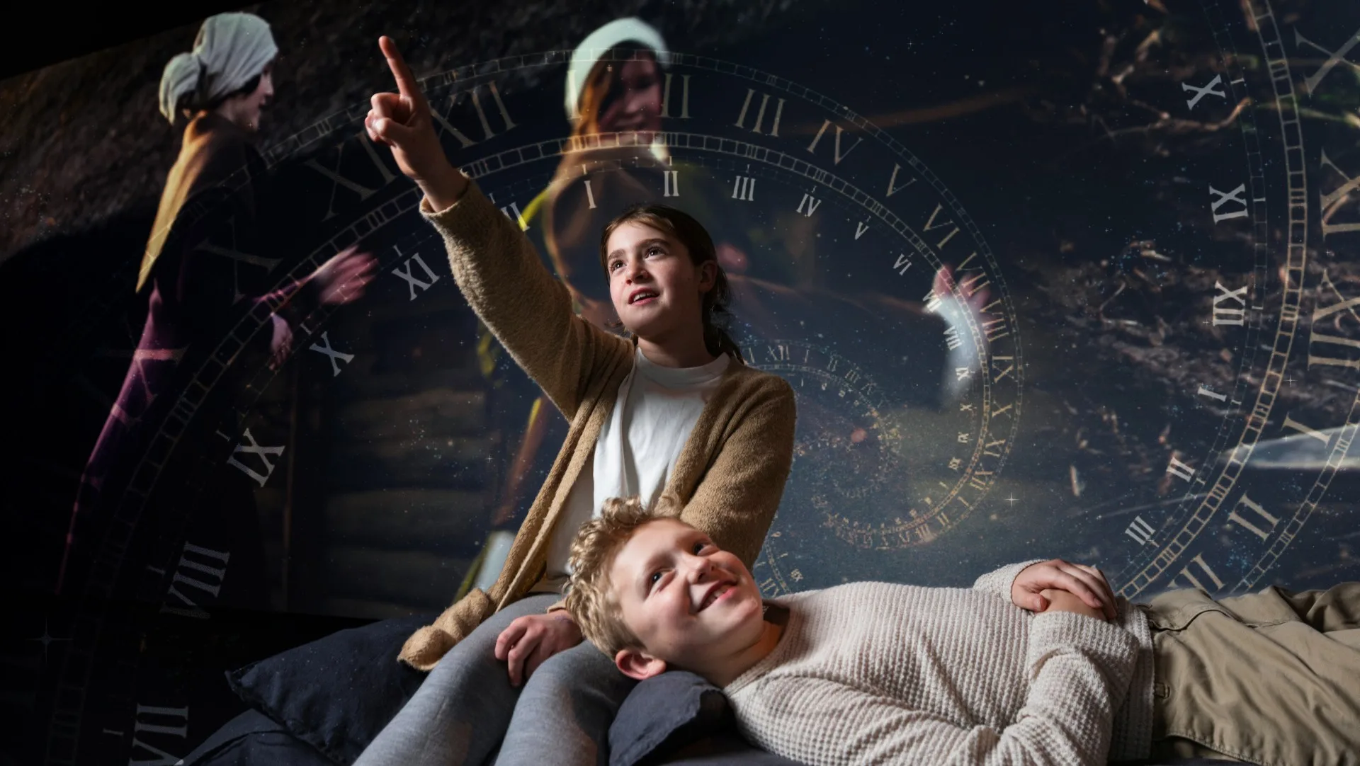 Barn sitter tillsammans och pekar på något