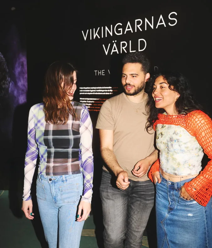 Three visitors in the exhibition
