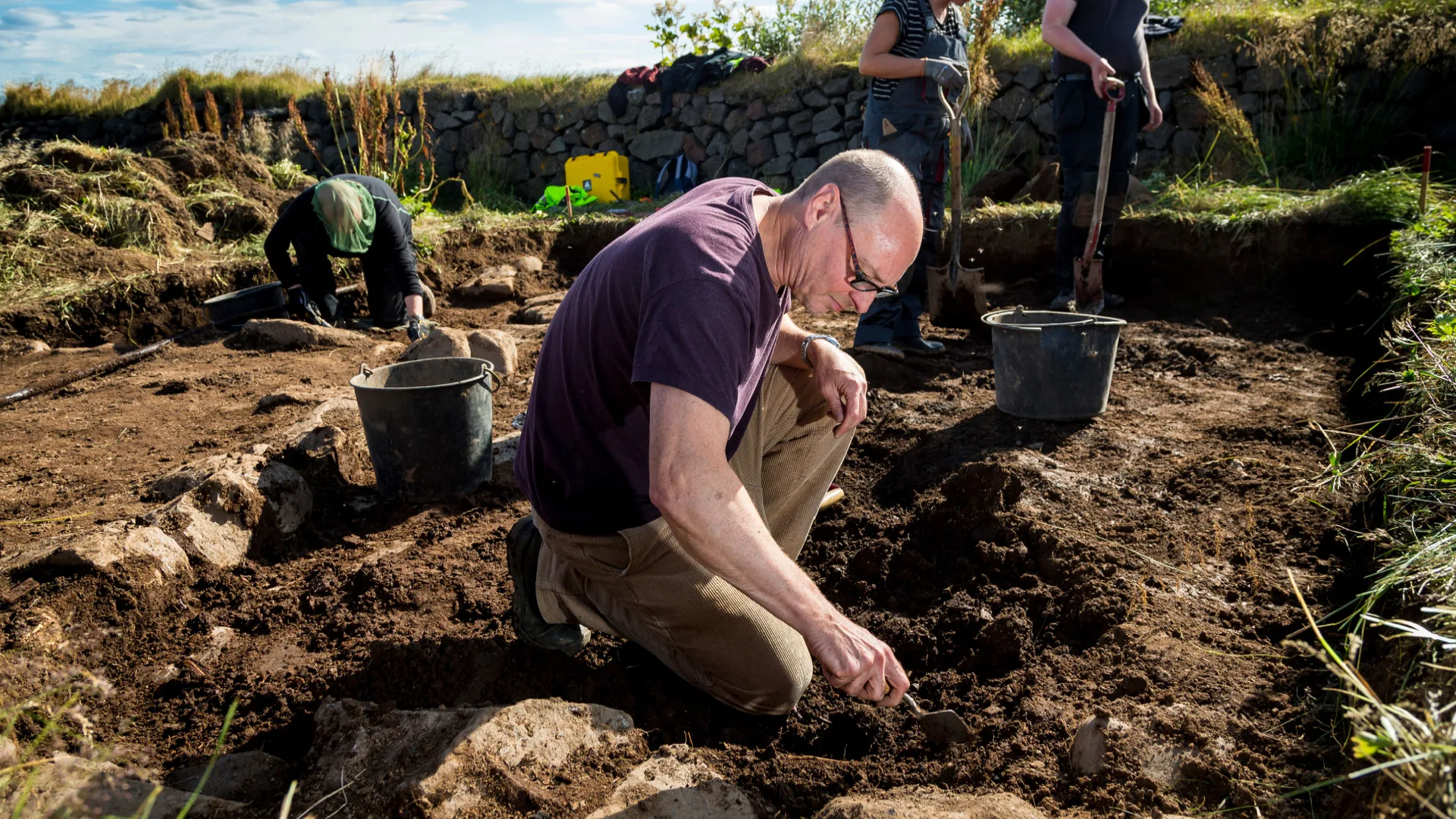 A person digging in the ground.