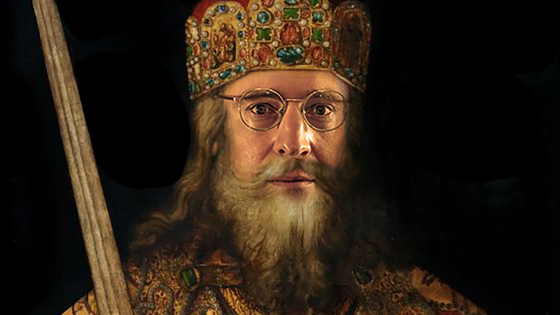 En medeltida kung med krona och svärd.