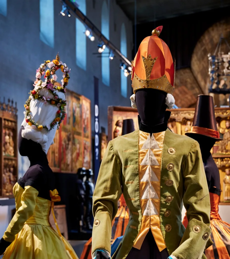 Mannequins with costumes in an exhibition hall